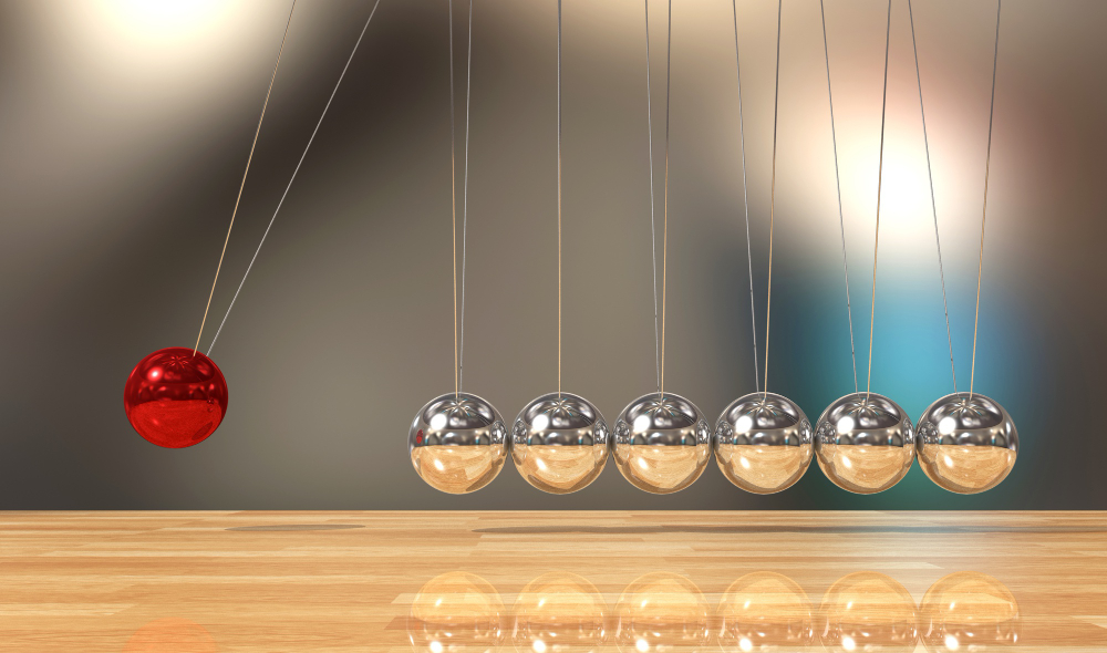 Image of a balancing balls to depict physics