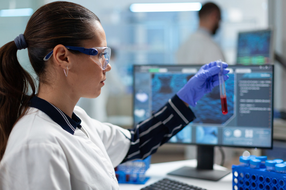 Image of Biomedicine student with microscope. 