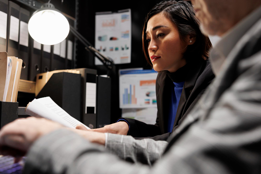 Image of business colleagues reviewing financial accounts. 
