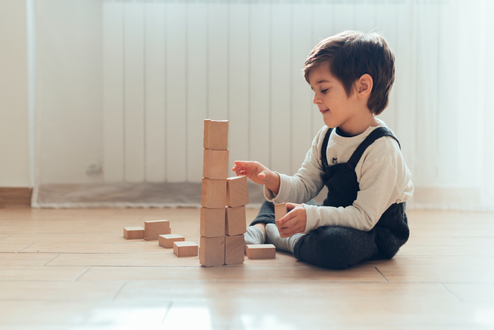 Image of a child with building blocks