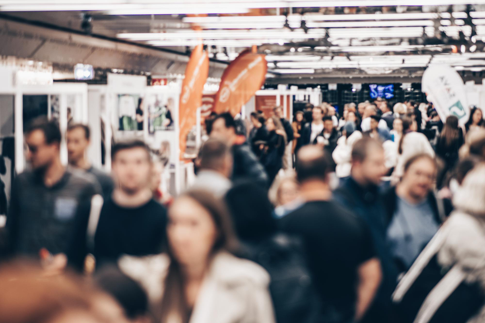 Image of large number of people attending an exhibition