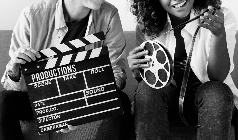 Man and woman holding film reel to depict Film Studies