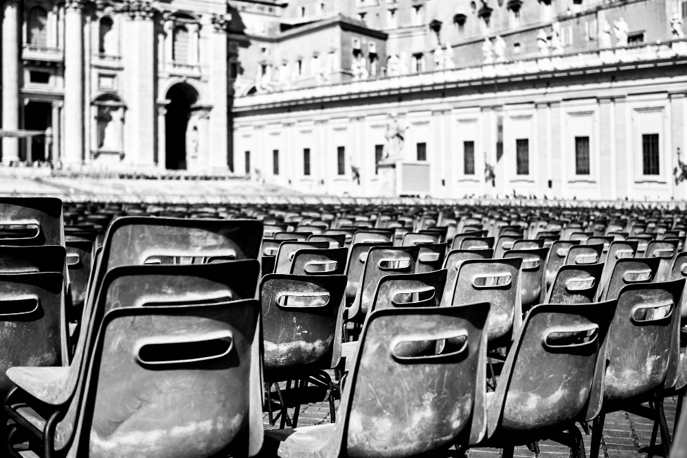 Image of chairs in city square. 
