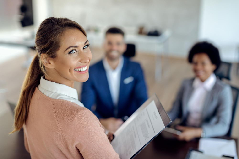 Image of woman holding CV at interview