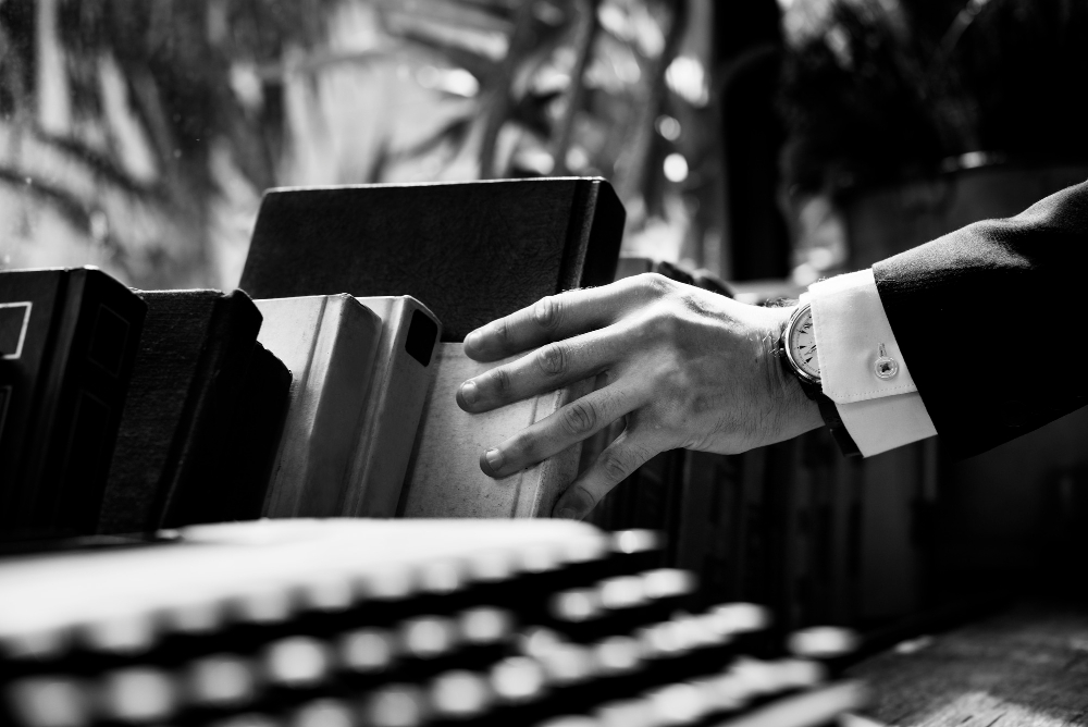 Image of student selecting legal books. 