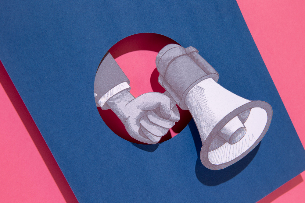 Image of a hand holding a megaphone to depict PR