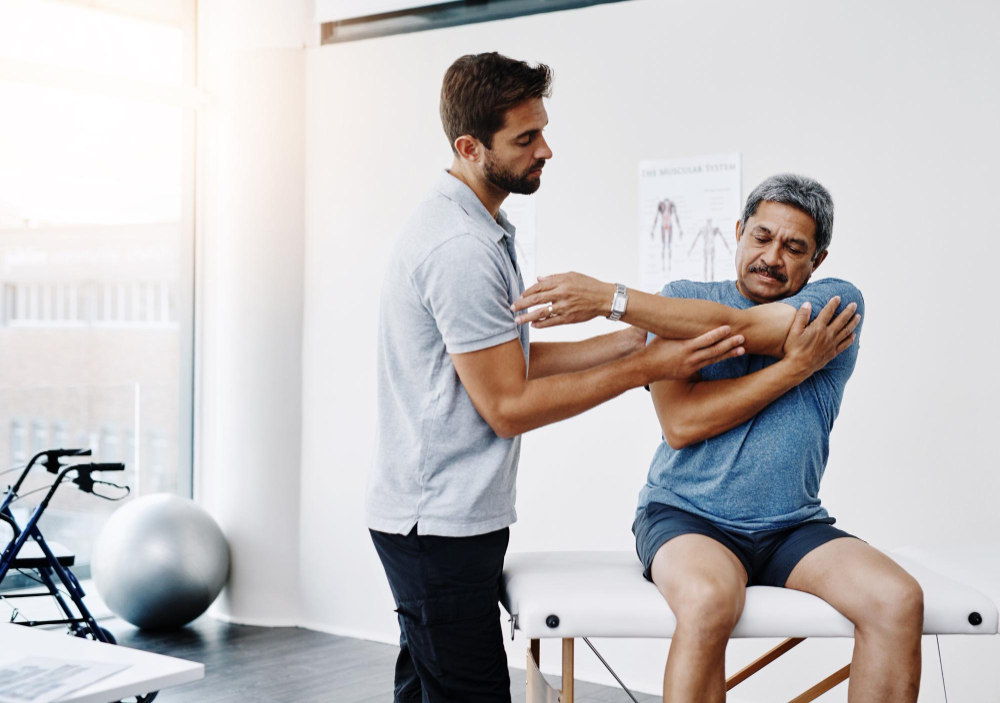 Image of a physiotherapist helping a patient. 