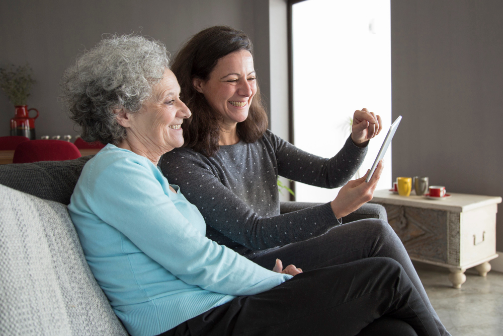 Image of a social worker with a resident. 
