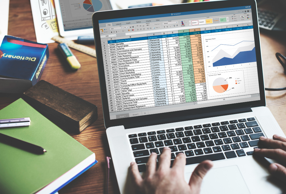 Image of a laptop with spreadsheets.