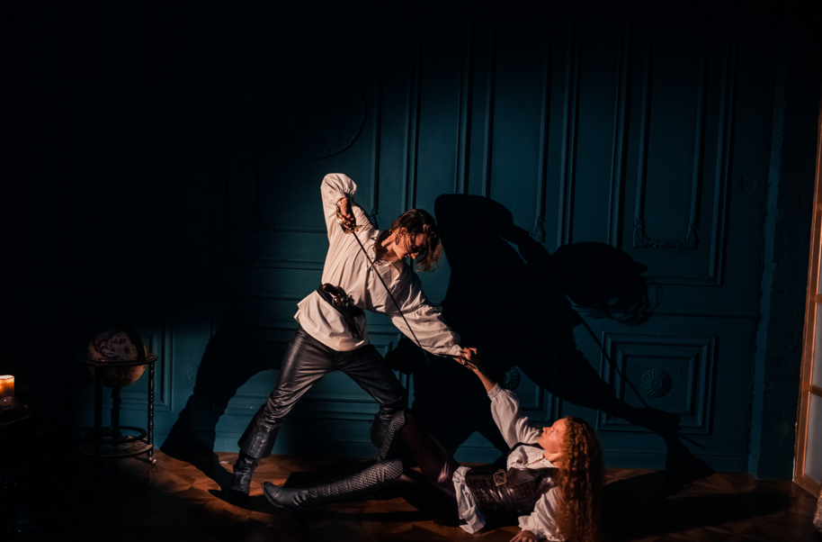 Image of man and woman depicting dramatic fighting scene. 